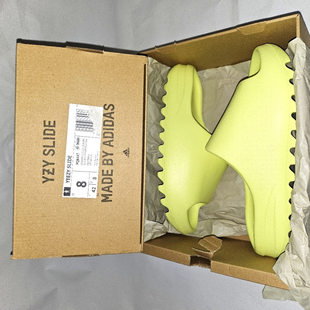 Selling Adidas Yeezy Glow Green slides